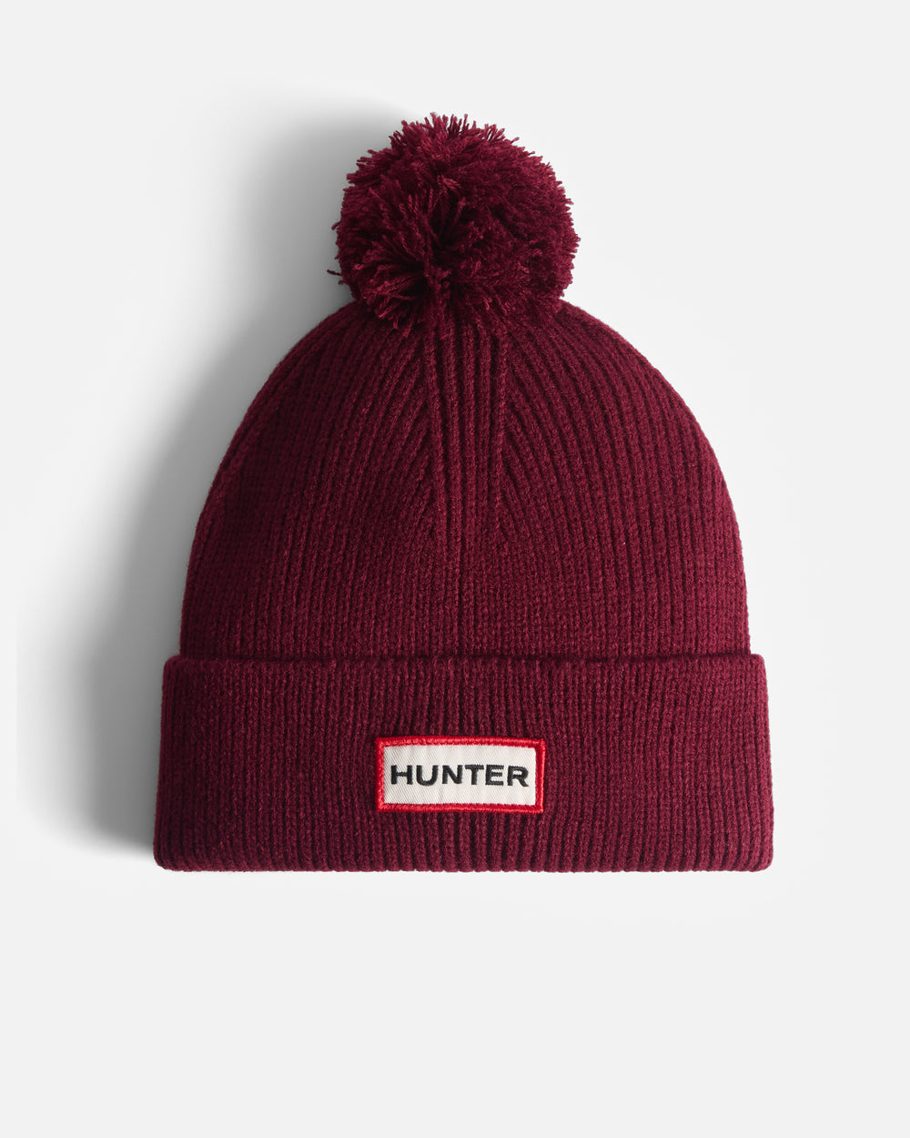 Brenig Ribbed Pom Mütze in Rot (Unisex)